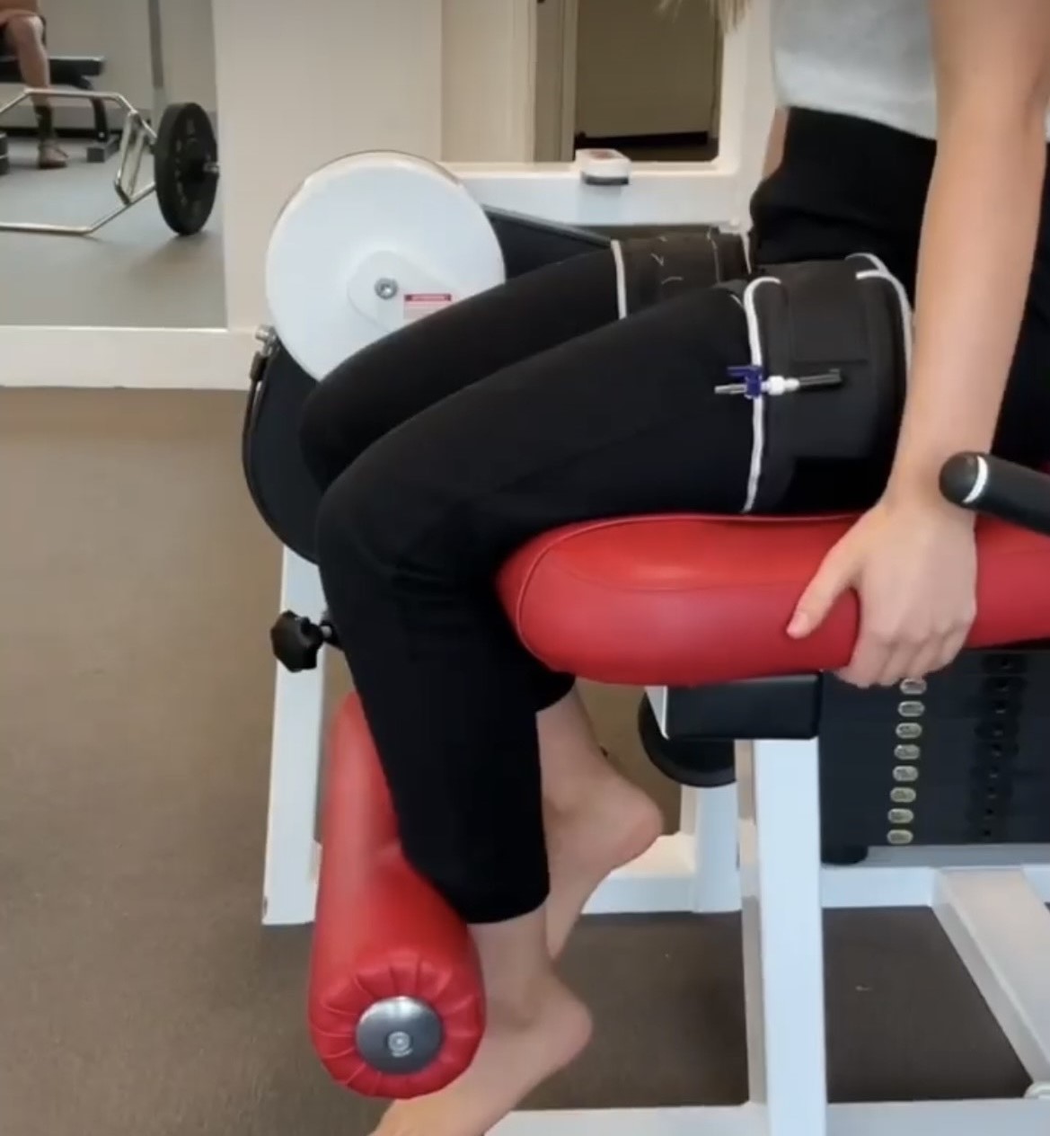 Physiotherapist assisting client with BFR training at Saunders Physiotherapy