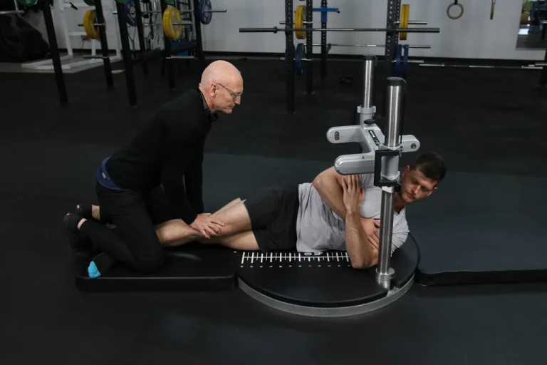 Kangatech strength testing technology measuring a patient's hip strength in a physiotherapy clinic
